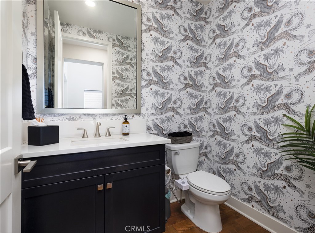 93 Turnstone Irvine, CA 92618 - Photo 31 of 52 a bathroom with a granite countertop toilet sink and mirror