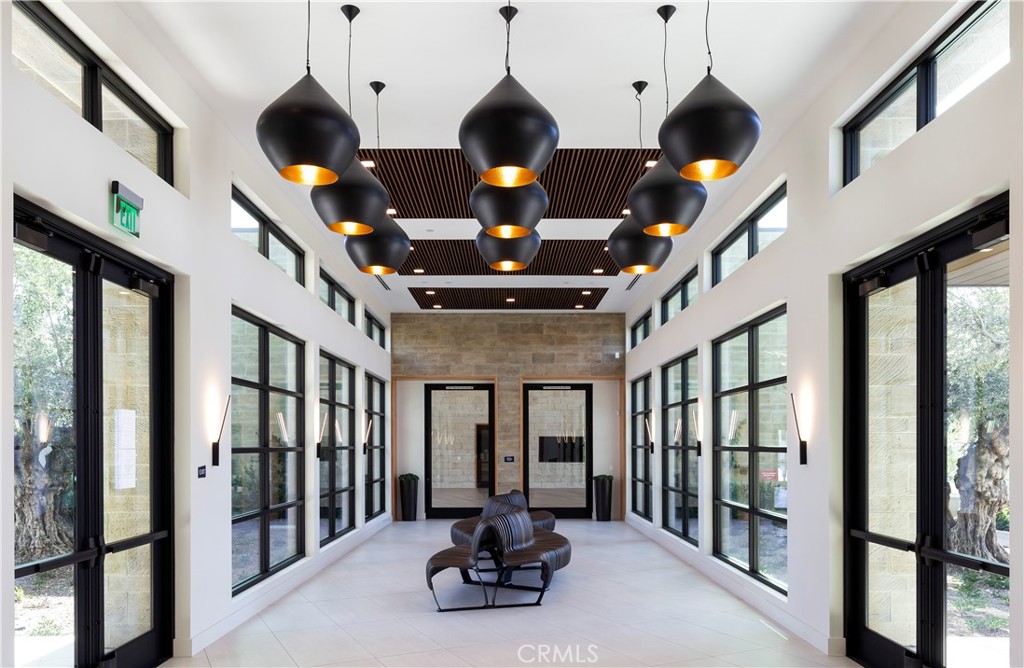 93 Turnstone Irvine, CA 92618 - Photo 9 of 52 a living room with furniture ceiling fan and a large window