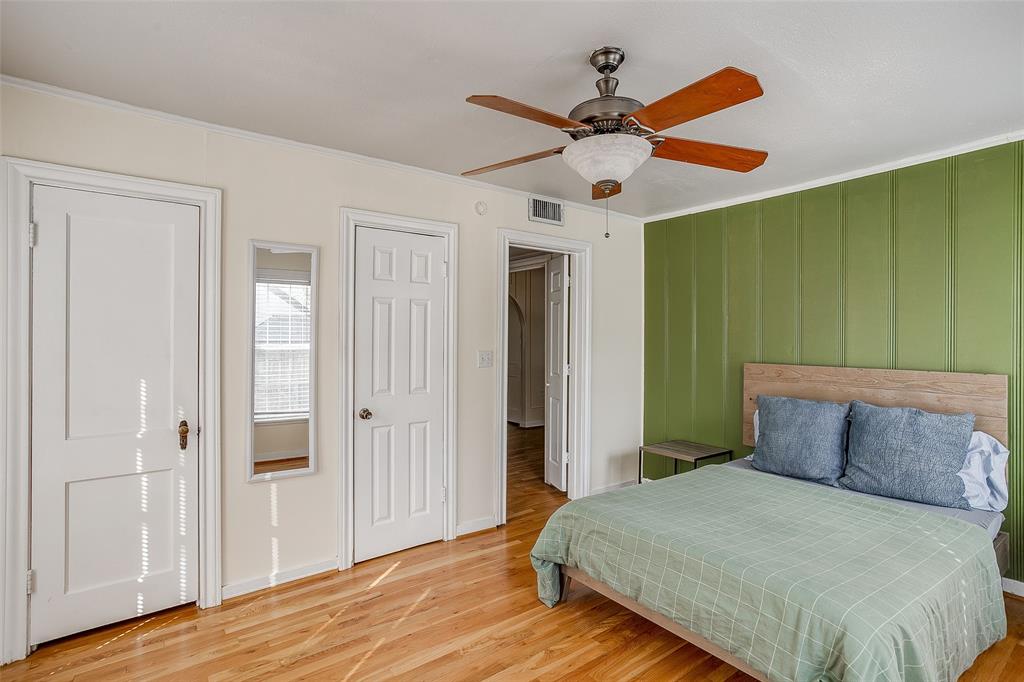 4339 Pershing Avenue Fort Worth, TX 76107 - Photo 5 of 19 a bedroom with a bed and a chandelier