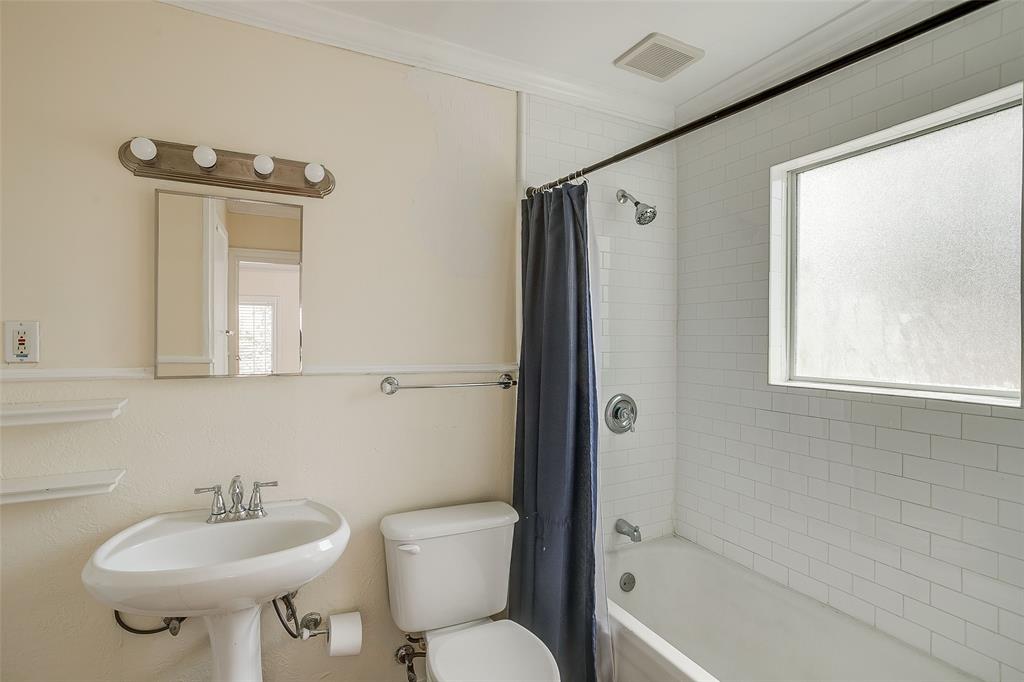 4339 Pershing Avenue Fort Worth, TX 76107 - Photo 6 of 19 a bathroom with a sink toilet and shower
