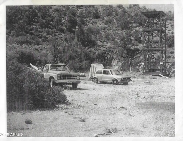 a view of a backyard with table and chairs