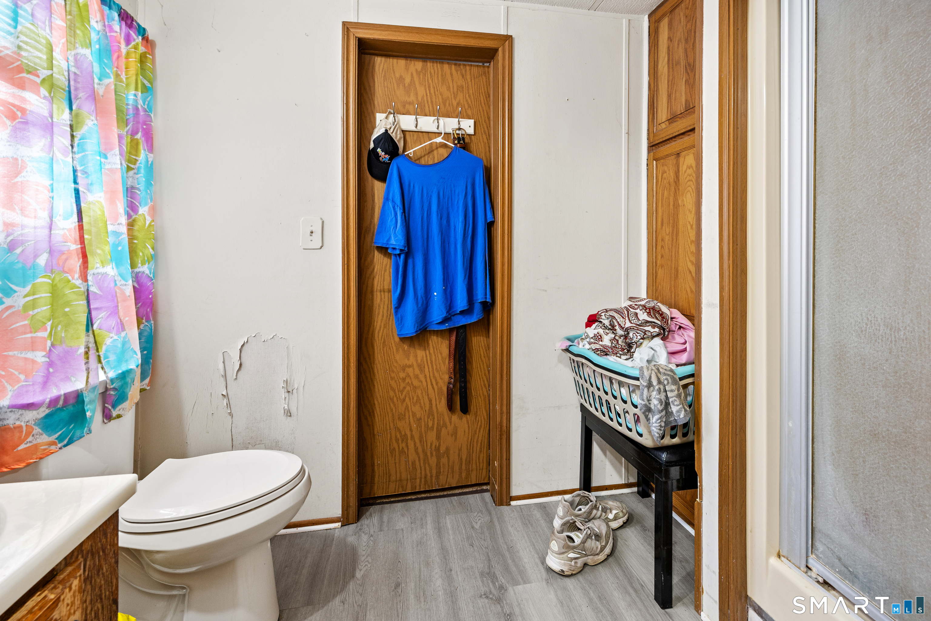 8 Redstone Street Southington, CT 06489 - Photo 17 of 18 a bathroom with a toilet and a shower curtain