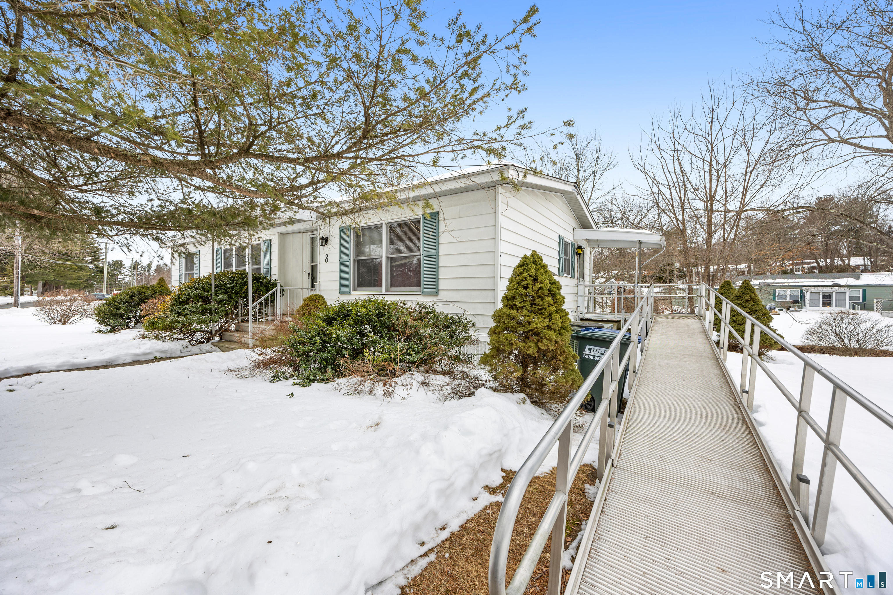 8 Redstone Street Southington, CT 06489 - Photo 2 of 18 a view of a house with snow on the road