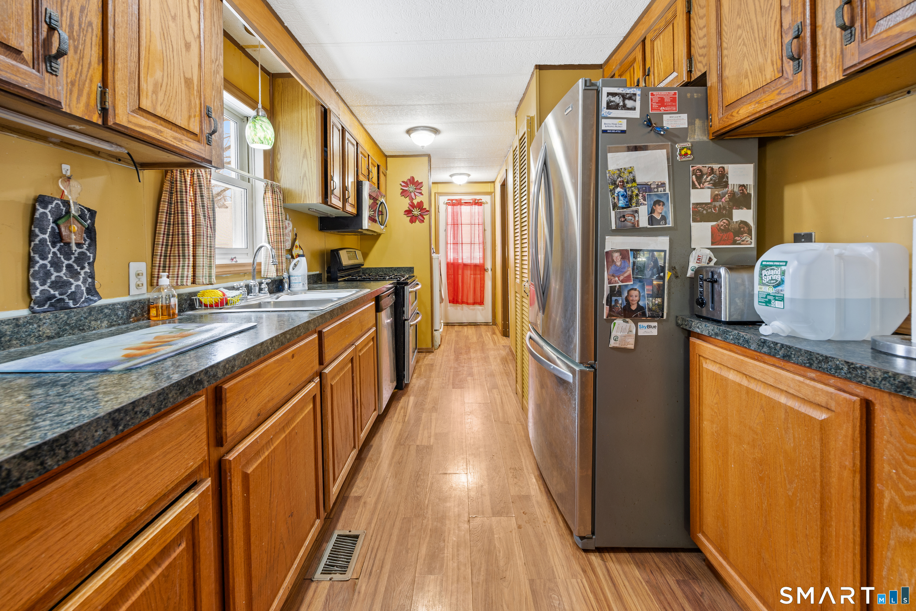 8 Redstone Street Southington, CT 06489 - Photo 5 of 18 a kitchen with stainless steel appliances granite countertop a refrigerator a sink and a stove