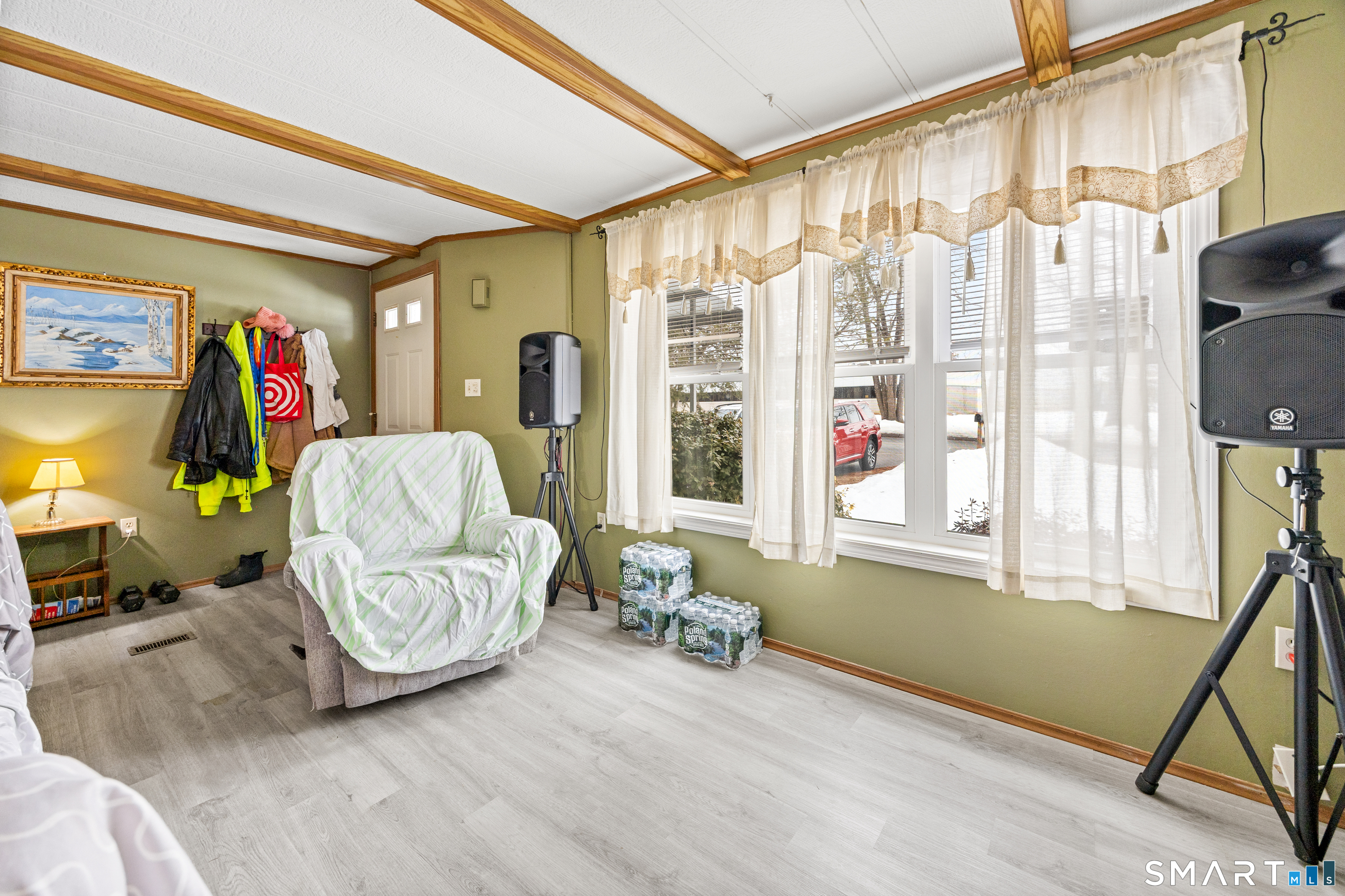 8 Redstone Street Southington, CT 06489 - Photo 9 of 18 a living room with furniture and a flat screen tv