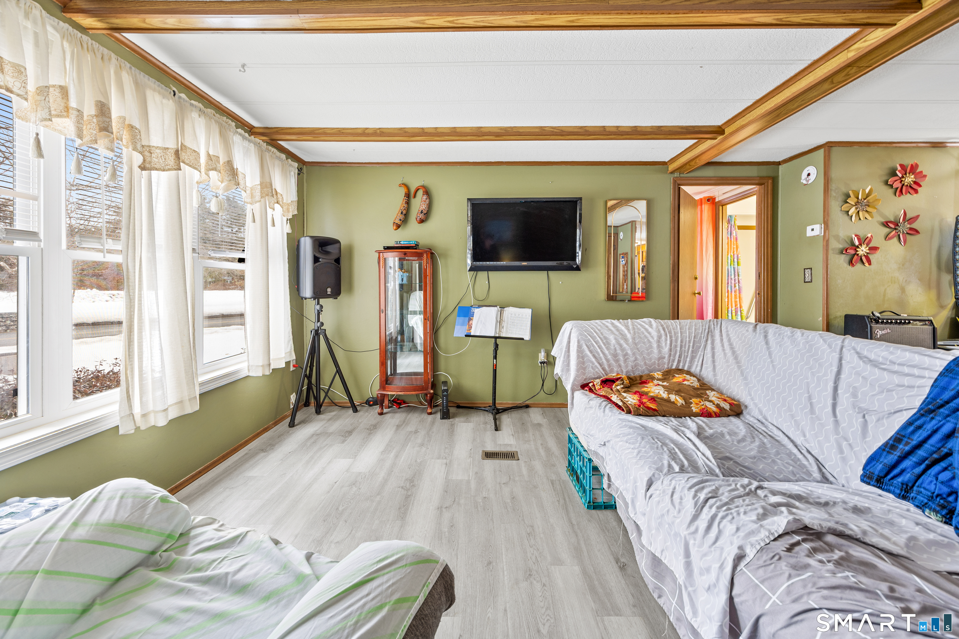 8 Redstone Street Southington, CT 06489 - Photo 10 of 18 a living room with furniture and a flat screen tv