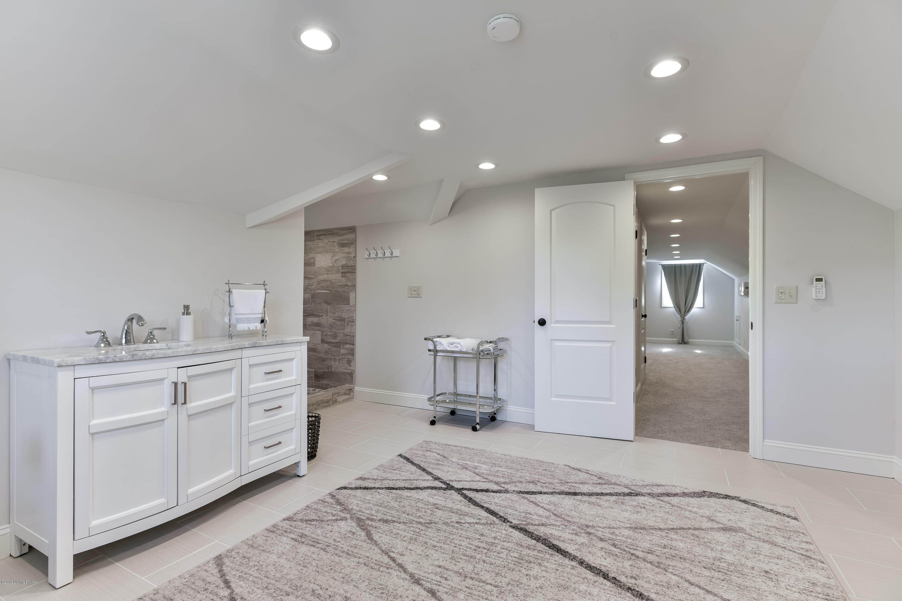 3110 Sherbrooke Road Louisville, KY 40205 - Photo 64 of 69 Recessed lighting, multiple windows and a neutral color palette give the space a light and open feel