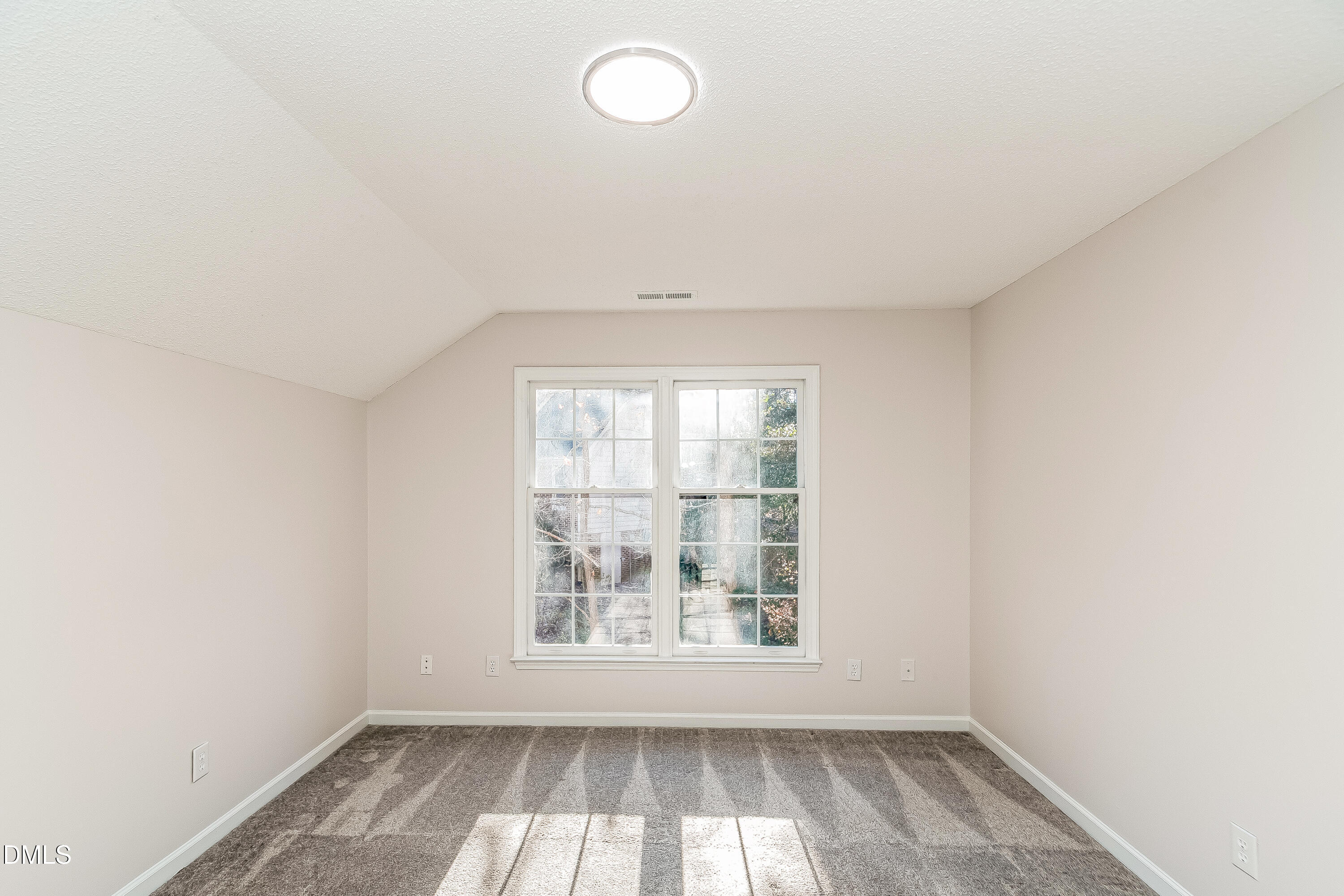 6005 Chittim Court Raleigh, NC 27616 - Photo 16 of 19 an empty room with wooden floor and windows