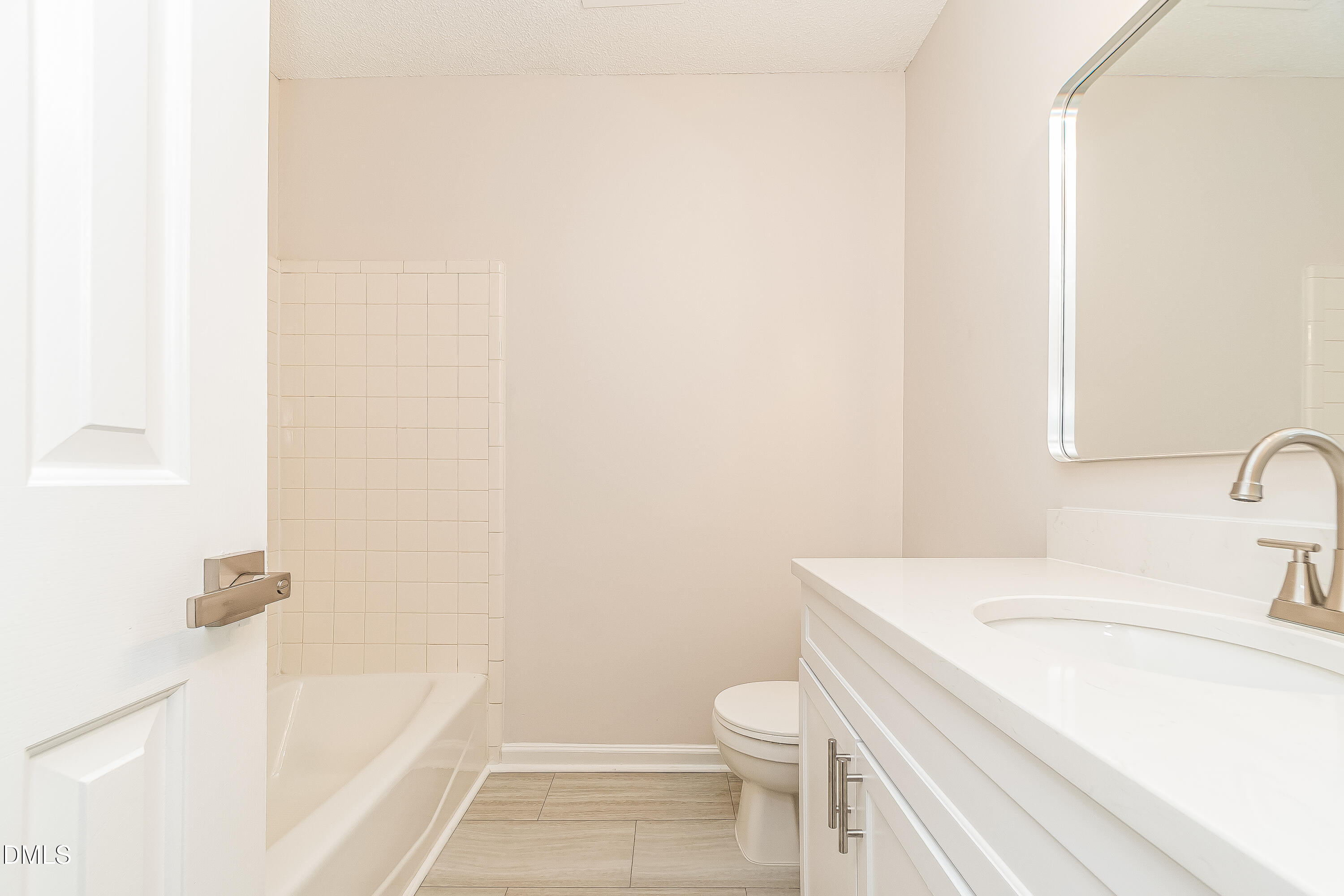 6005 Chittim Court Raleigh, NC 27616 - Photo 17 of 19 a bathroom with a sink a toilet and shower