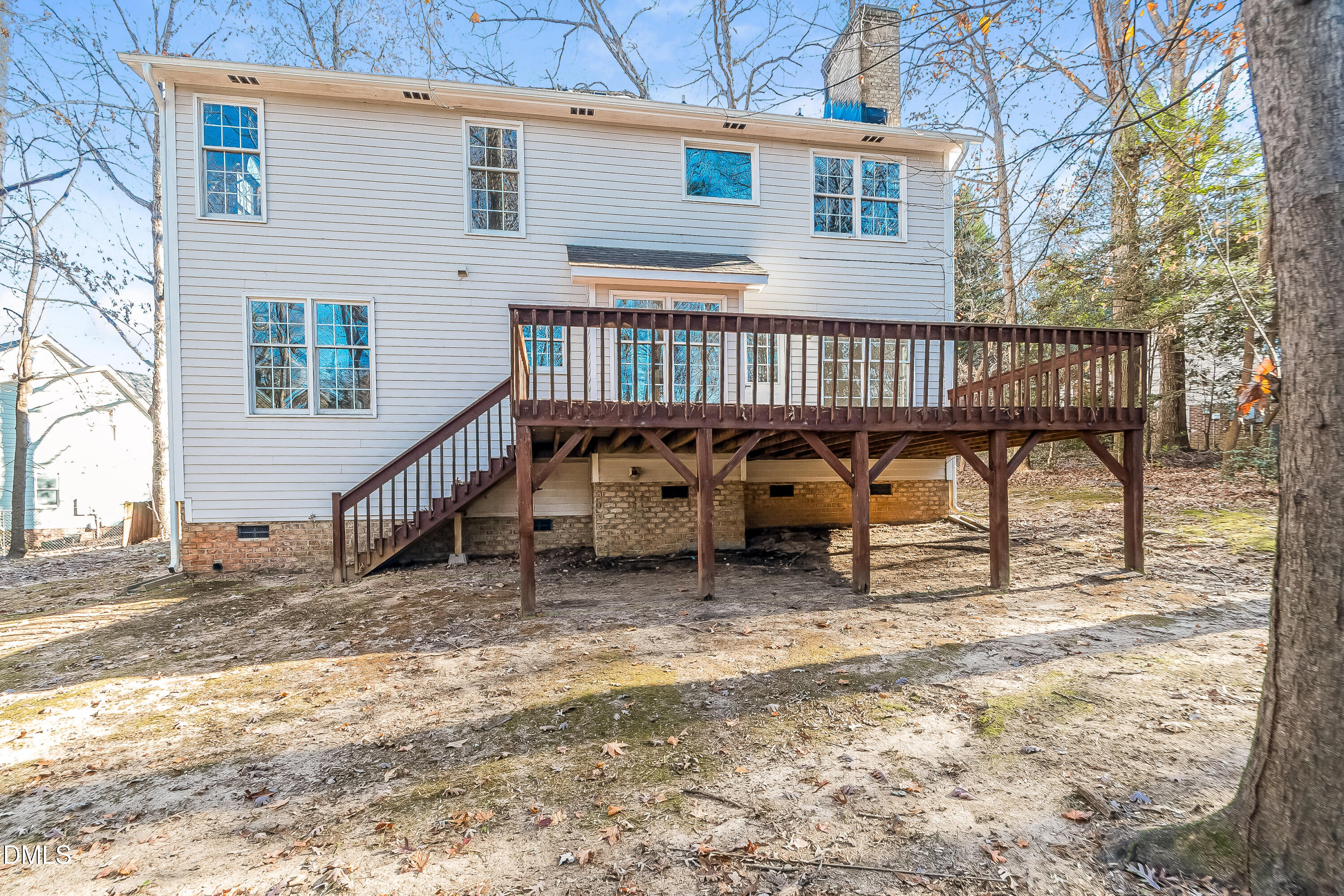 6005 Chittim Court Raleigh, NC 27616 - Photo 19 of 19 a view of a house with a wooden deck and furniture