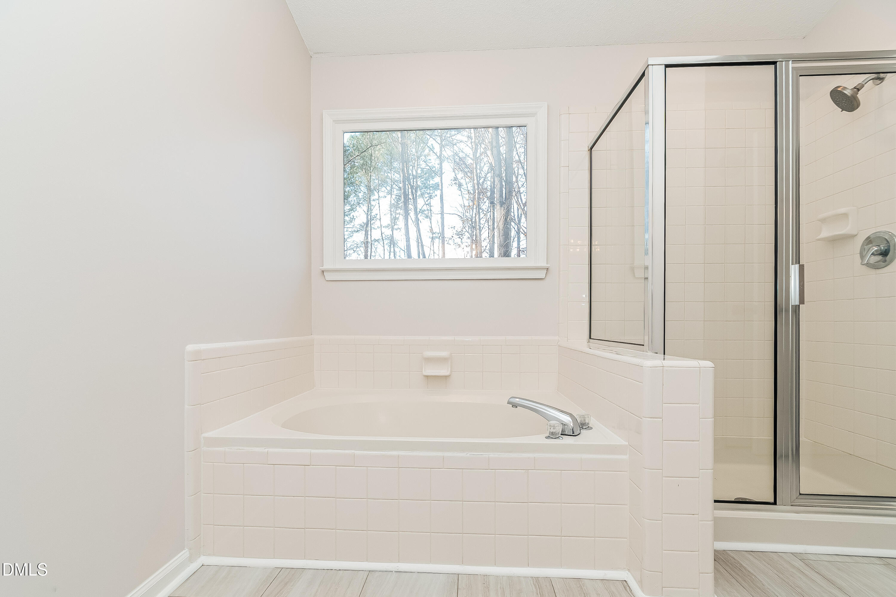 6005 Chittim Court Raleigh, NC 27616 - Photo 10 of 19 a white bath tub with a shower