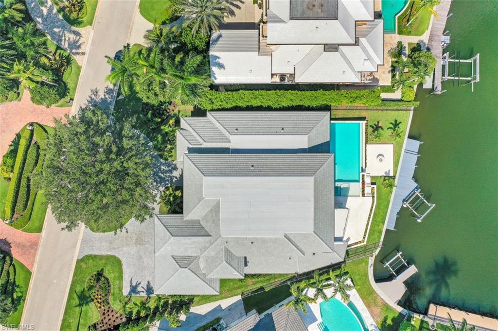 313 Turtle Hatch Road Naples, FL 34103 - Photo 4 of 34 an aerial view of residential houses with outdoor space and parking