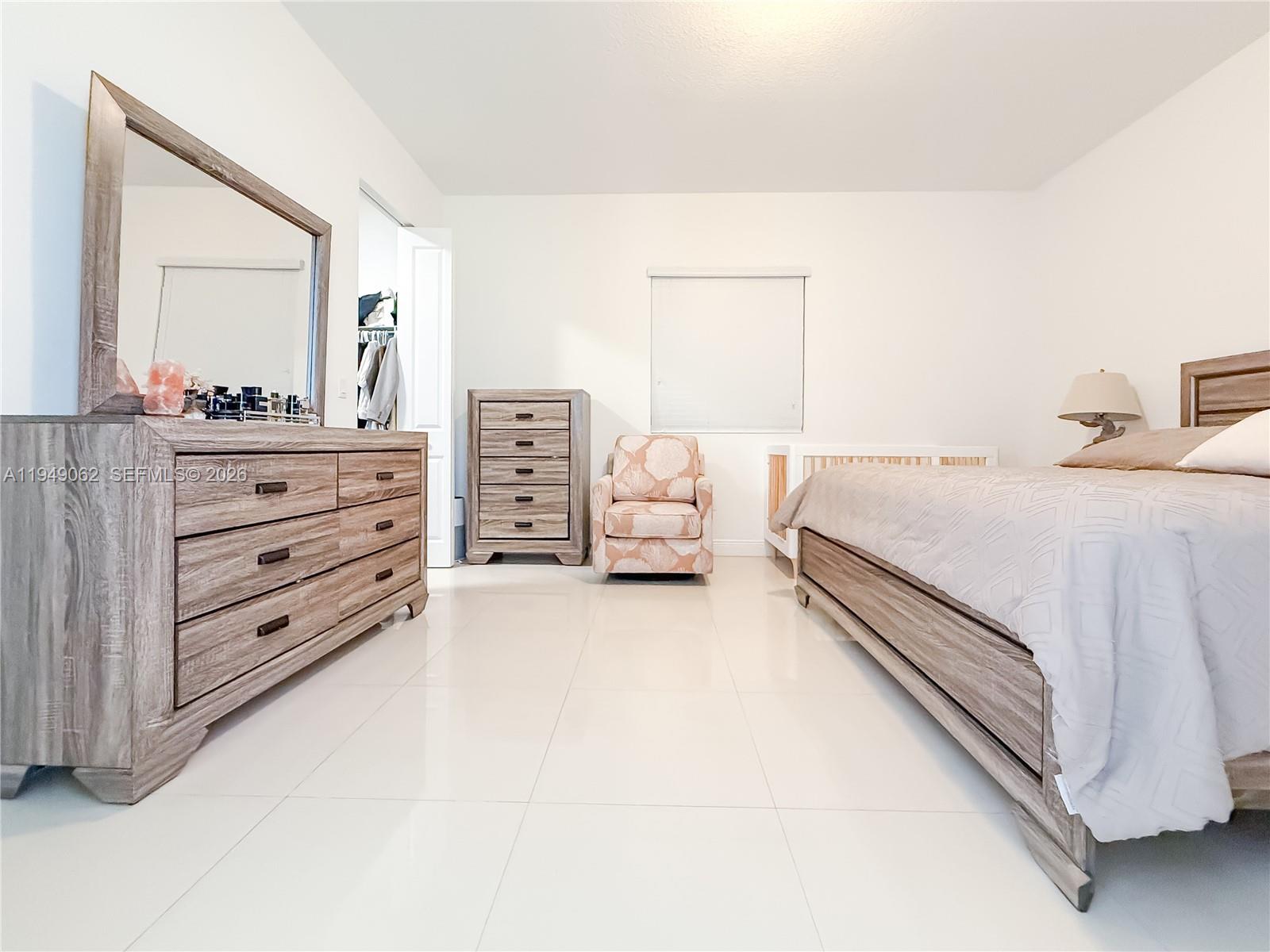 17931 Southwest 152nd Avenue Miami, FL 33187 - Photo 14 of 29 a bedroom with a bed and a dresser