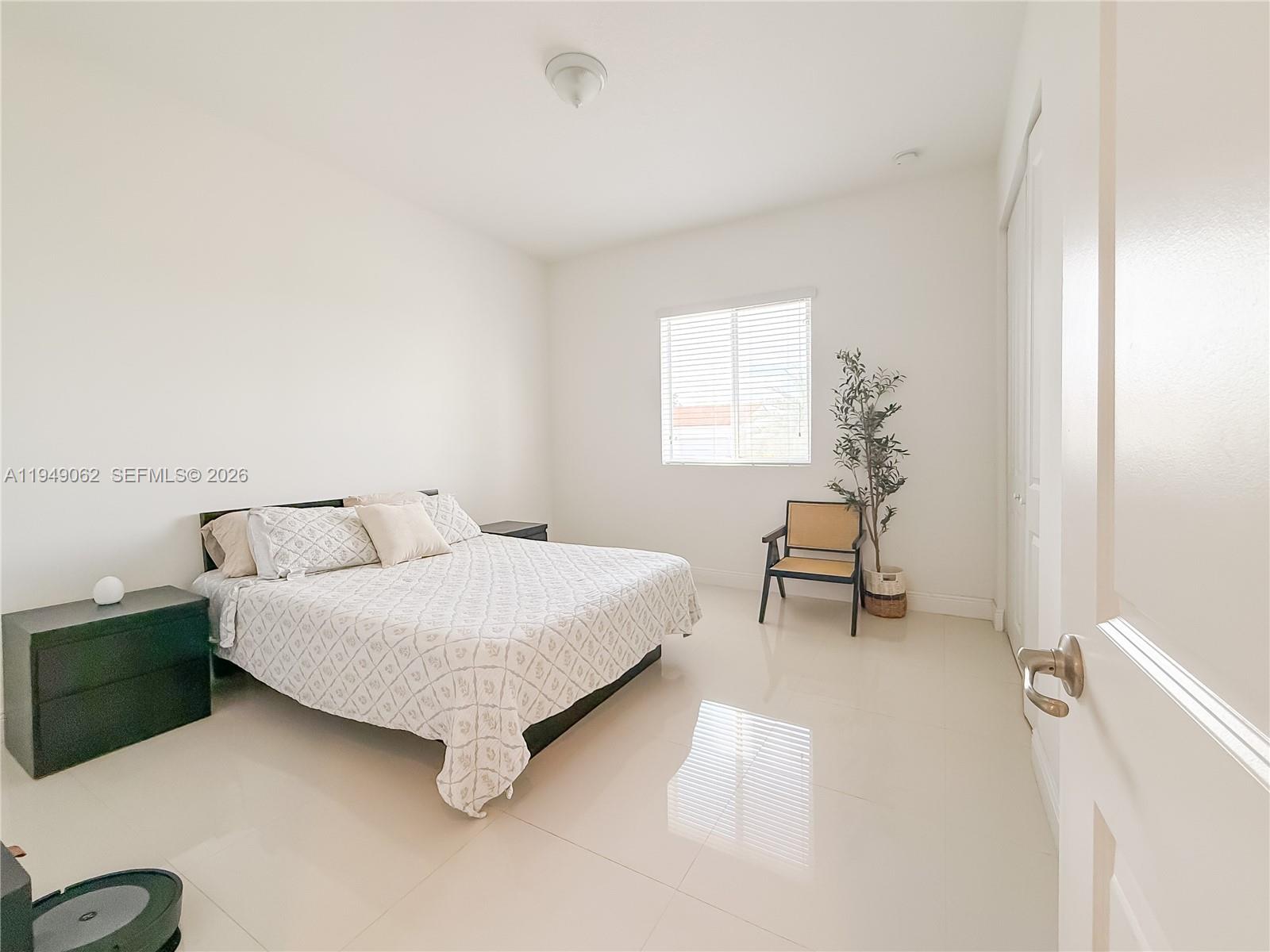 17931 Southwest 152nd Avenue Miami, FL 33187 - Photo 20 of 29 a living room with furniture and a window