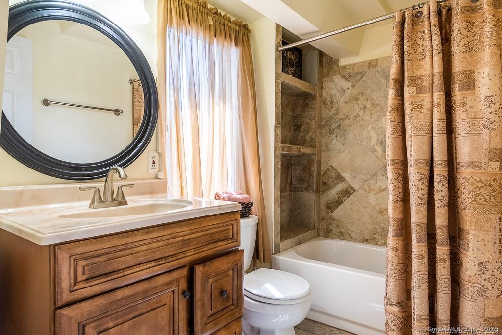 2 Valley Road Westport, CT 06880 - Photo 17 of 21 a bathroom with a granite countertop sink toilet and shower