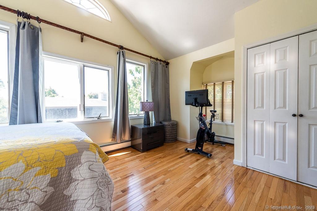 2 Valley Road Westport, CT 06880 - Photo 18 of 21 a bedroom with a bed and wooden floor