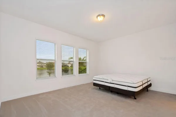 a room with a bed and a window