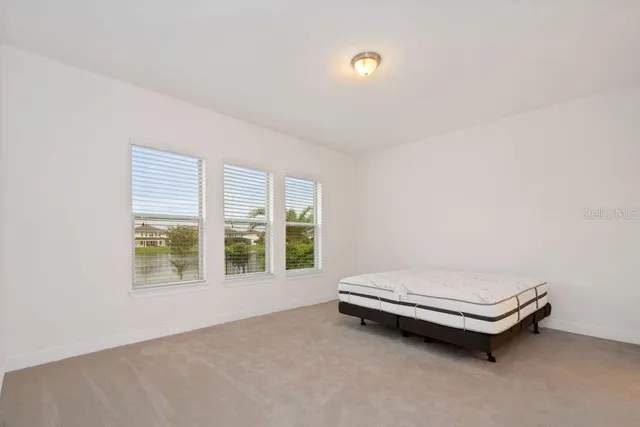 a room with a bed and a window