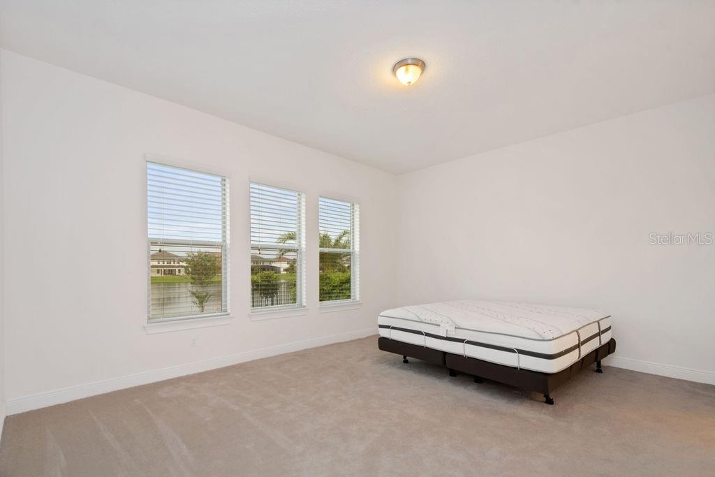 17538 Black Rail Street Windermere, FL 34786 - Photo 13 of 32 a room with a bed and a window