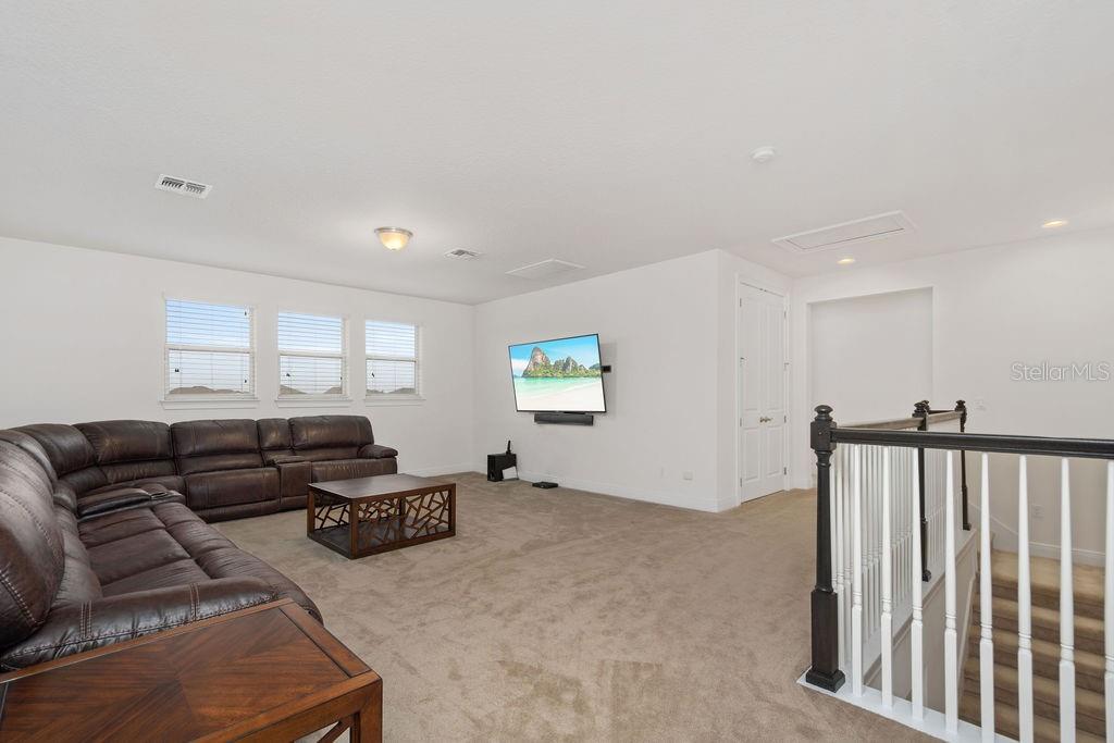 17538 Black Rail Street Windermere, FL 34786 - Photo 17 of 32 a living room with furniture and a window