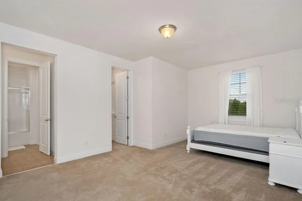 a room with a bed and a window