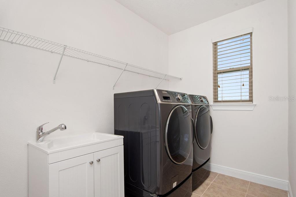 17538 Black Rail Street Windermere, FL 34786 - Photo 25 of 32 a utility room with dryer and washer
