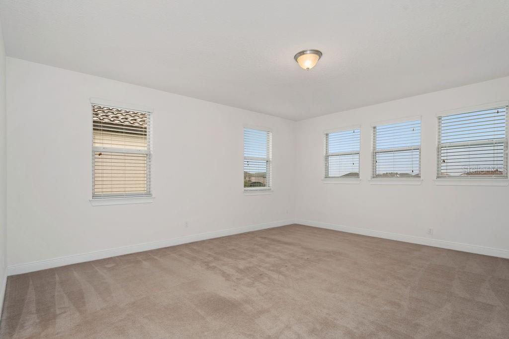 17538 Black Rail Street Windermere, FL 34786 - Photo 26 of 32 a view of an empty room with a window