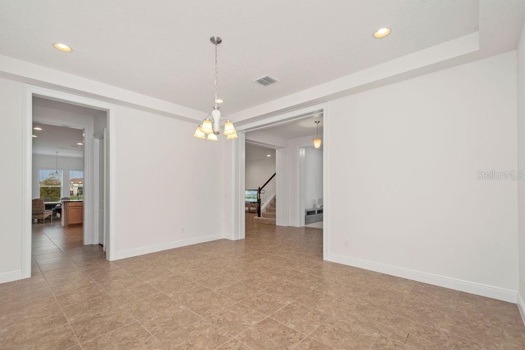 17538 Black Rail Street Windermere, FL 34786 - Photo 3 of 32 wooden floor in an empty room with a window