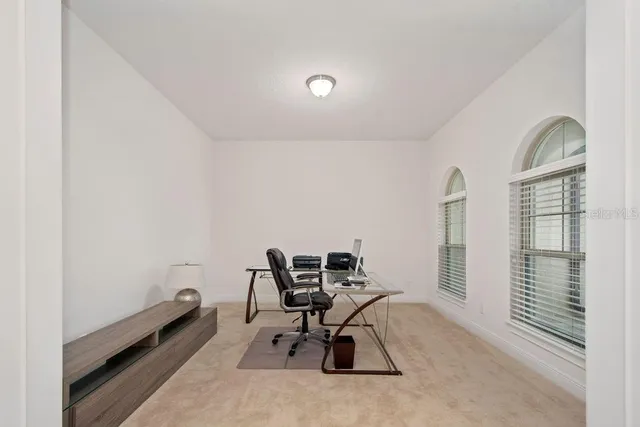 a work room with furniture and windows