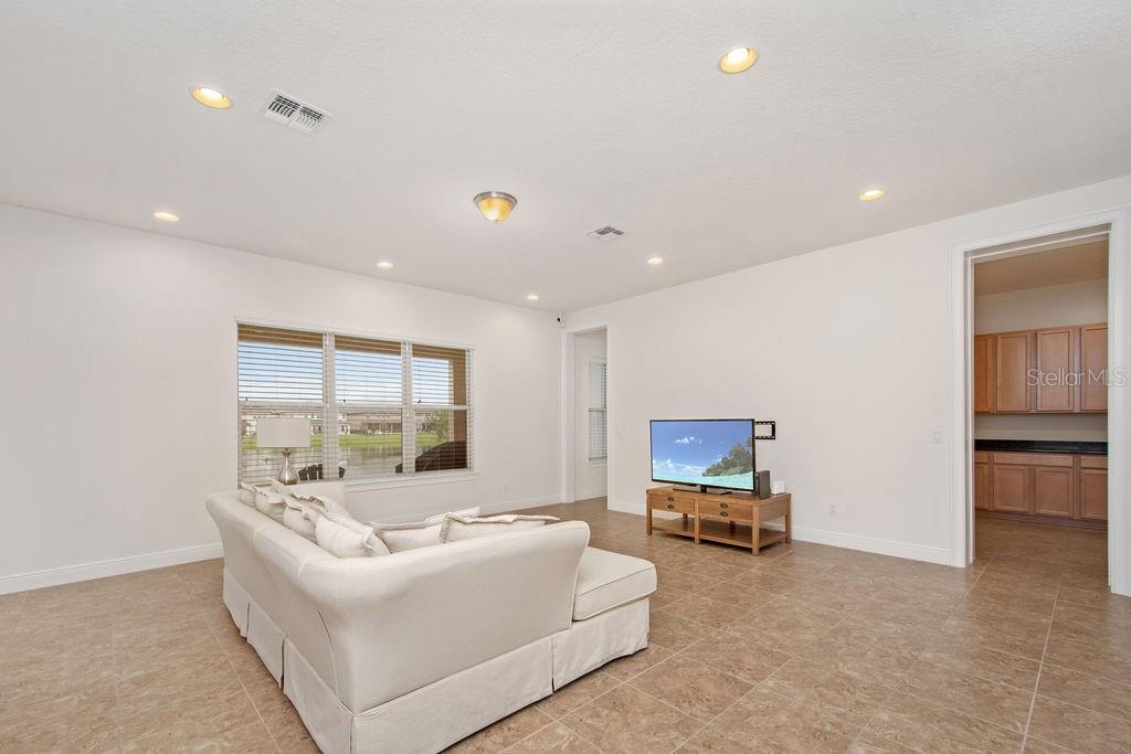 17538 Black Rail Street Windermere, FL 34786 - Photo 5 of 32 a living room with furniture and a flat screen tv