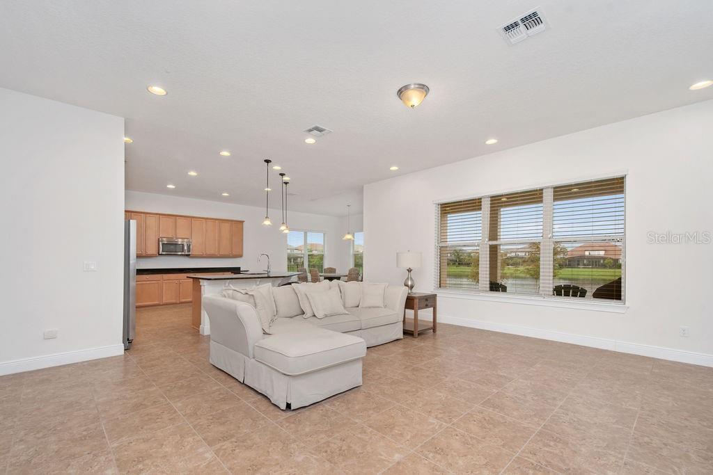 17538 Black Rail Street Windermere, FL 34786 - Photo 7 of 32 a living room with furniture and a large window
