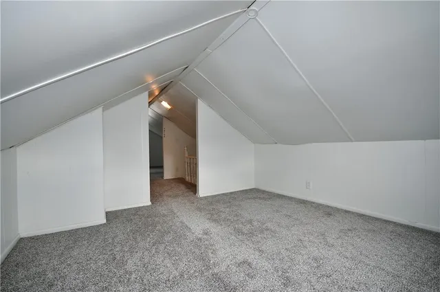 an empty room with a empty space and windows