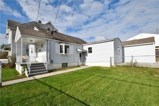 a house view with a garden space