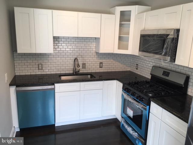 12331 Dunks Ferry Road Philadelphia, PA 19154 - Photo 2 of 21 a kitchen with granite countertop white cabinets stainless steel appliances and a sink
