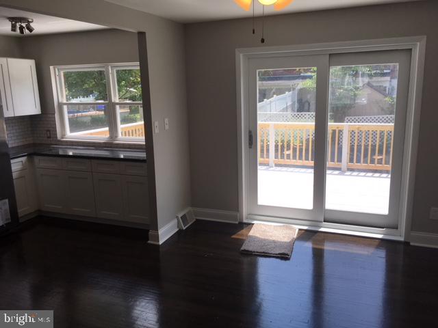 12331 Dunks Ferry Road Philadelphia, PA 19154 - Photo 13 of 21 a kitchen with granite countertop a stove a sink and a window