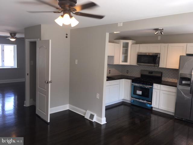 12331 Dunks Ferry Road Philadelphia, PA 19154 - Photo 15 of 21 a kitchen with a refrigerator and a stove top oven