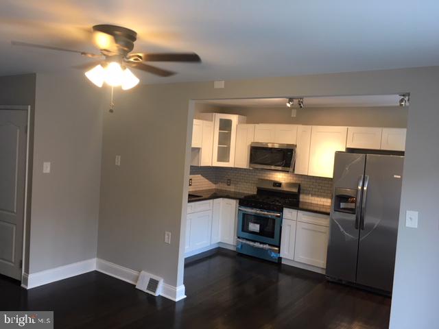 12331 Dunks Ferry Road Philadelphia, PA 19154 - Photo 7 of 21 a kitchen with stainless steel appliances granite countertop a refrigerator a stove a sink and a microwave