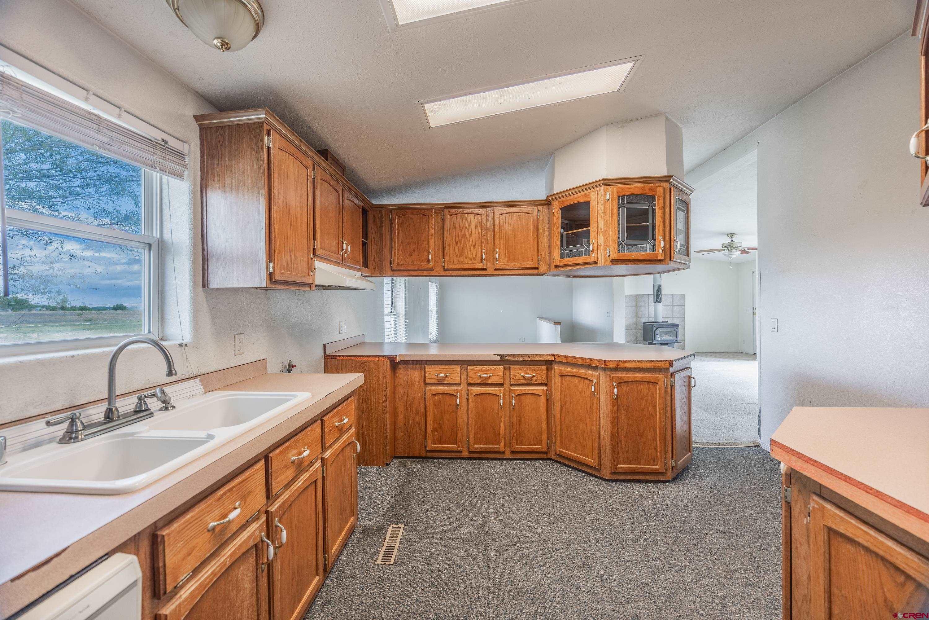 17377 Breeze Road Delta, CO 81416 - Photo 21 of 45 a kitchen that has a sink and a stove in it