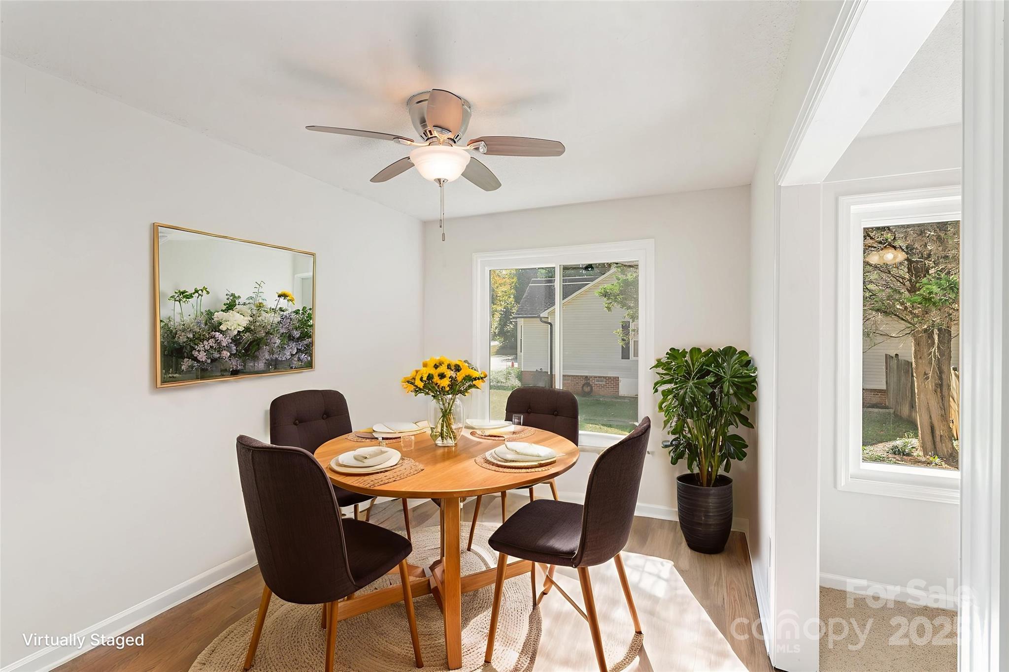 1700 Azalea Avenue Kannapolis, NC 28081 - Photo 12 of 34 a view of a dining room with furniture window and wooden floor