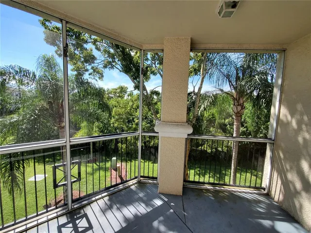 a view of a balcony with chairs