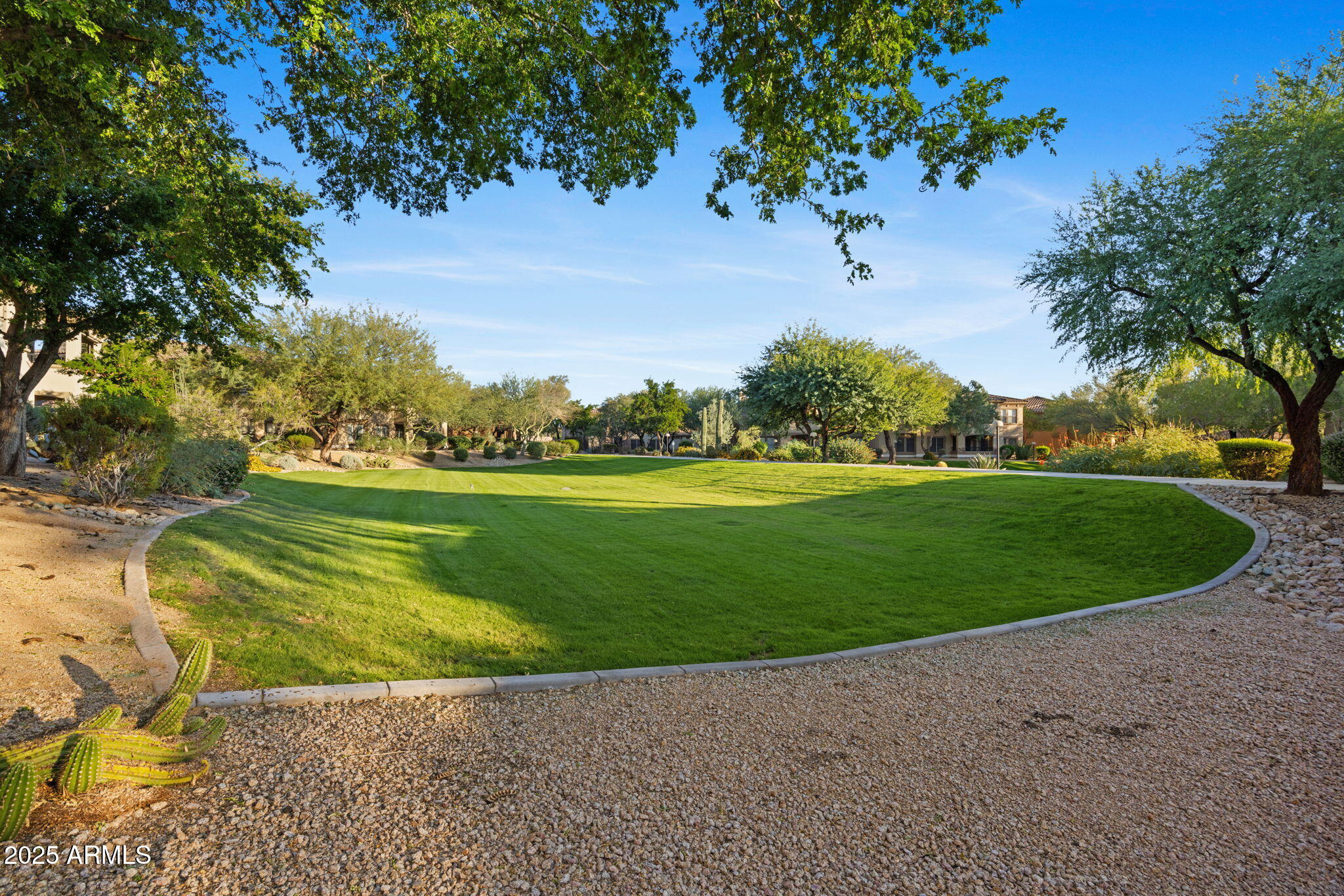 19700 North 76th Street, Unit 1040 Scottsdale, AZ 85255 - Photo 24 of 30 a view of a golf course with a lake view