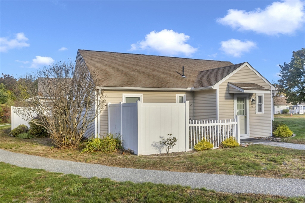 97 Collins Street, Unit 97 Chicopee, MA 01022 - Photo 20 of 21 a front view of a house with a yard