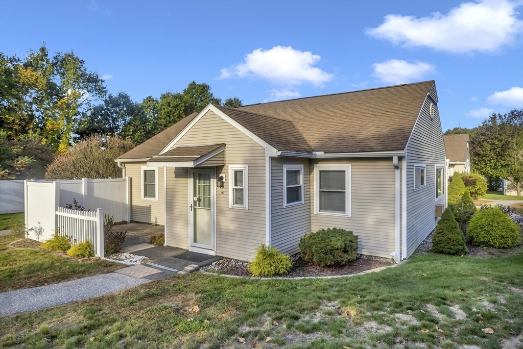 97 Collins Street, Unit 97 Chicopee, MA 01022 - Photo 2 of 21 a front view of a house with a yard