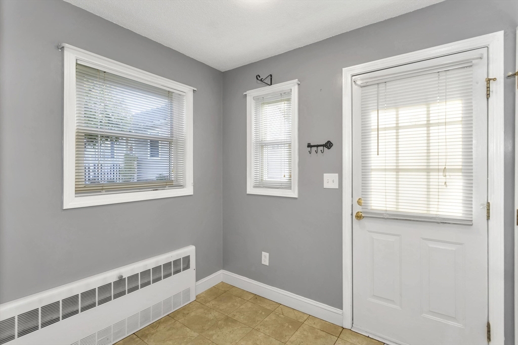 97 Collins Street, Unit 97 Chicopee, MA 01022 - Photo 4 of 21 a view of an empty room with a window