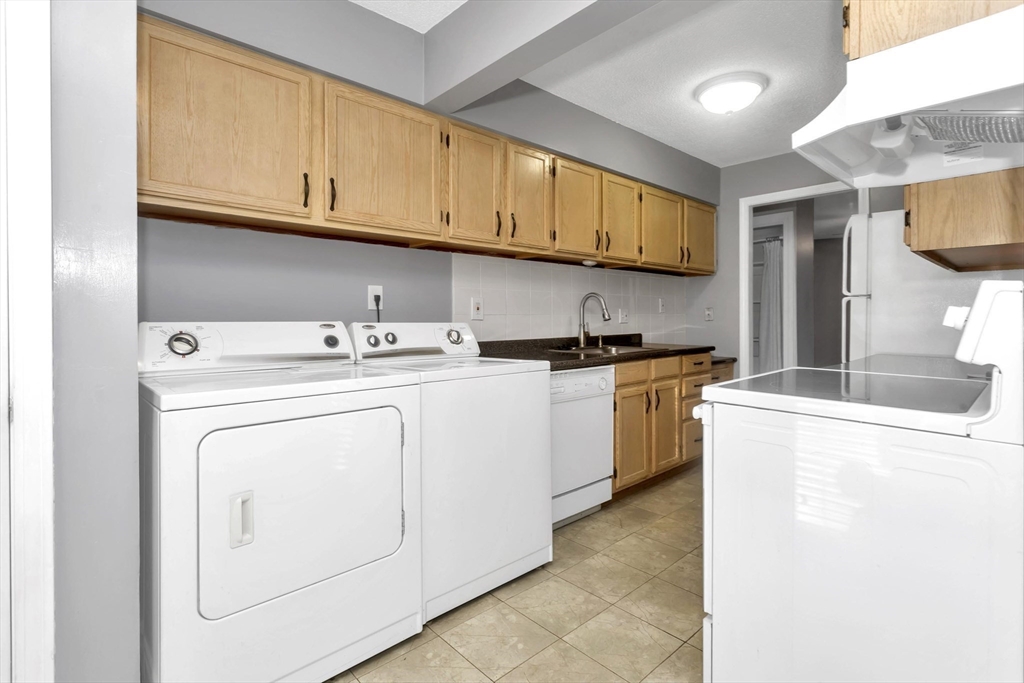 97 Collins Street, Unit 97 Chicopee, MA 01022 - Photo 8 of 21 a utility room with dryer and washer