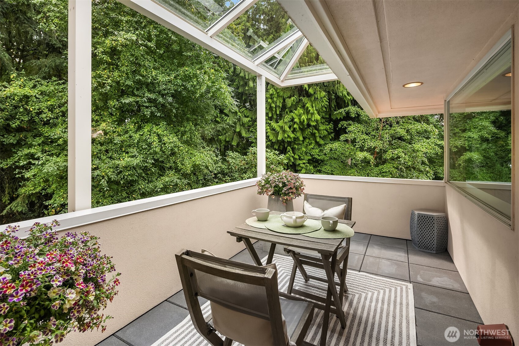 2609 Evergreen Point Road Medina, WA 98039 - Photo 23 of 39 a view of a patio with table and chairs and potted plants