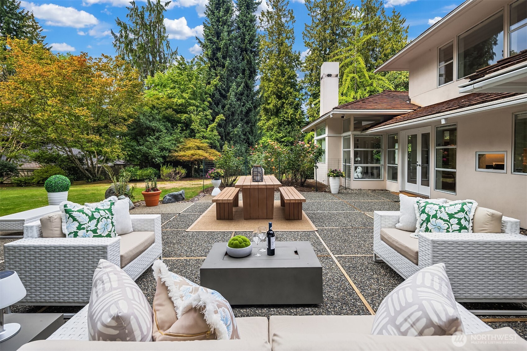 2609 Evergreen Point Road Medina, WA 98039 - Photo 33 of 39 a view of a patio with couches chairs and a fire pit