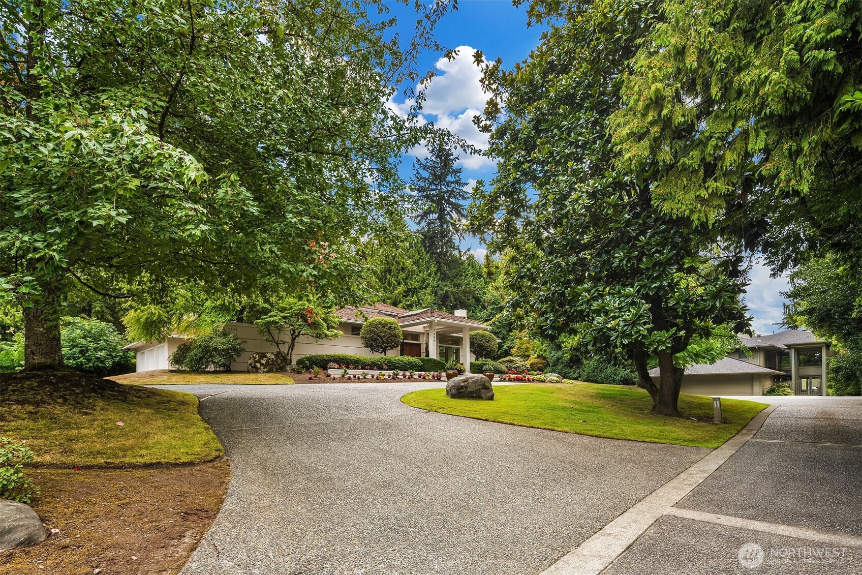 2609 Evergreen Point Road Medina, WA 98039 - Photo 38 of 39 a view of a swimming pool with an outdoor space and seating area