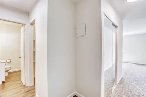 a view of room with wooden floor