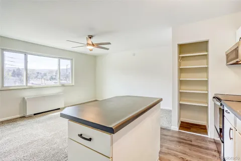 a kitchen with stainless steel appliances granite countertop a stove a sink dishwasher and a refrigerator